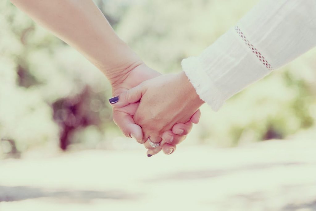 Young couple holding hands