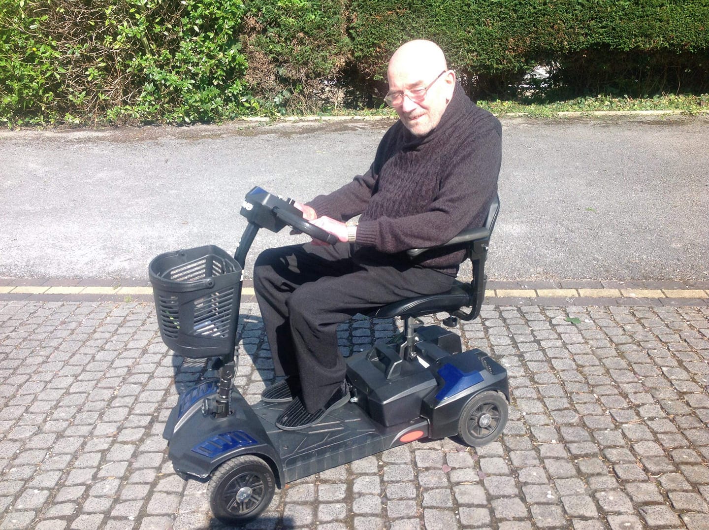 Old man on a mobility scooter