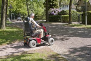 mobility scooter crosses the street